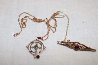 A 9ct gold Art Nouveau-style pendant necklace set peridot and seed pearls and a 9ct gold bar brooch