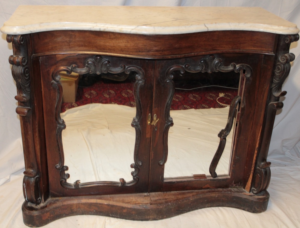 A 19th century carved rosewood serpentine-fronted side cabinet with white marble slab top and