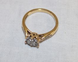 An 18ct gold dress ring set a diamond cluster flanked by two bands of diamond chips (3.