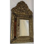A good quality modern cushion-style mirror with central compartment enclosed by a hinged mirror