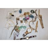 A selection of various costume jewellery, ladies' wristwatches, earrings etc.