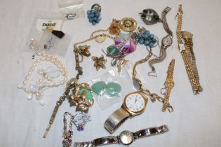 A selection of various costume jewellery, ladies' wristwatches, earrings etc.
