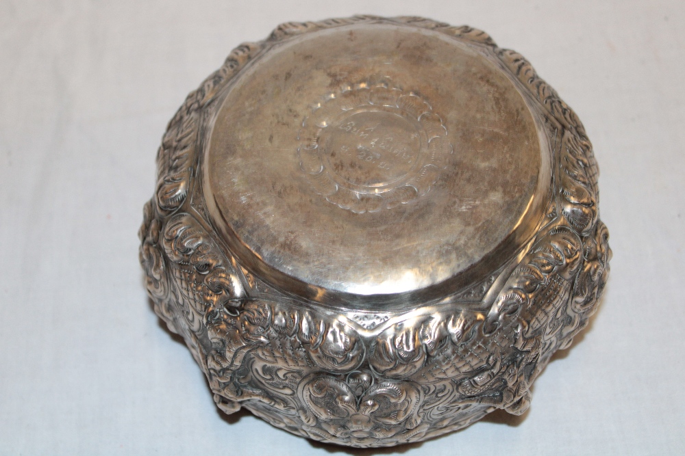 A Persian silvered circular bowl decorated in relief with scrolls and figures 6½" diameter - Image 2 of 2