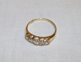 An 18ct gold dress ring set five graduated diamonds (3.