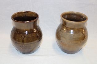 A pair of Wenford Bridge studio pottery tapered vases by Thiebaut Chague with incised green/brown