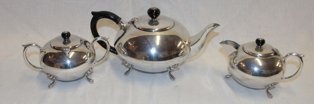 A good quality silver-plated three-piece tea set comprising circular tea pot with ebonised handle,