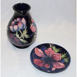A Moorcroft pottery tapered vase with anemone decoration,