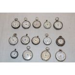 A selection of approximately fourteen various silver cased ladies' fob watches in varying