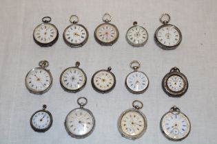 A selection of approximately fourteen various silver cased ladies' fob watches in varying