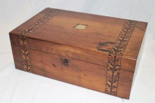 A Victorian inlaid walnut rectangular writing slope with part fitted interior,
