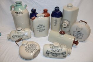 A collection of ten various stoneware hot water bottles including Doulton's Improved Foot Warmer,