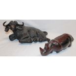 An Eastern carved wood figure of a recumbent water buffalo,