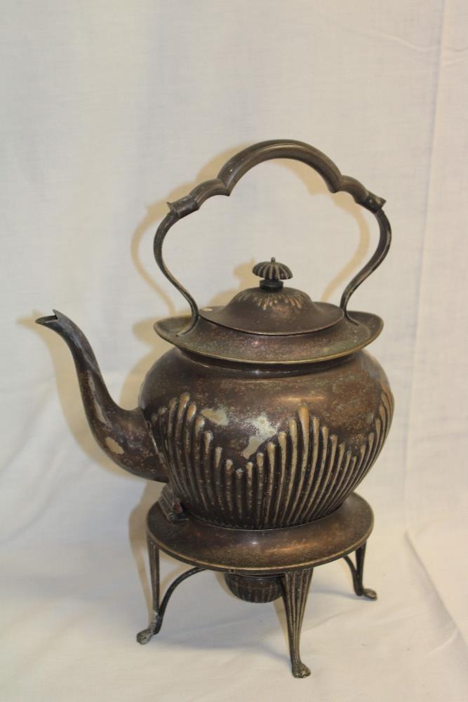 A silver-plated oval spirit kettle with raised decoration and hinged lid on oval matching stand