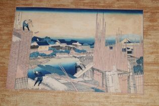 A 19th century Japanese wood block print depicting figures constructing buildings,