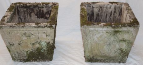 A pair of weathered composition square garden planters with raised decoration 14" x 14"
