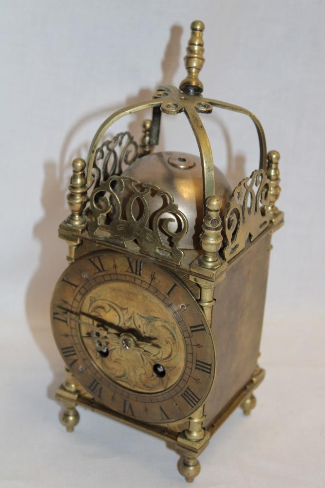 A 17th century-style brass lantern clock with French movement by Japy Freres in traditional case,