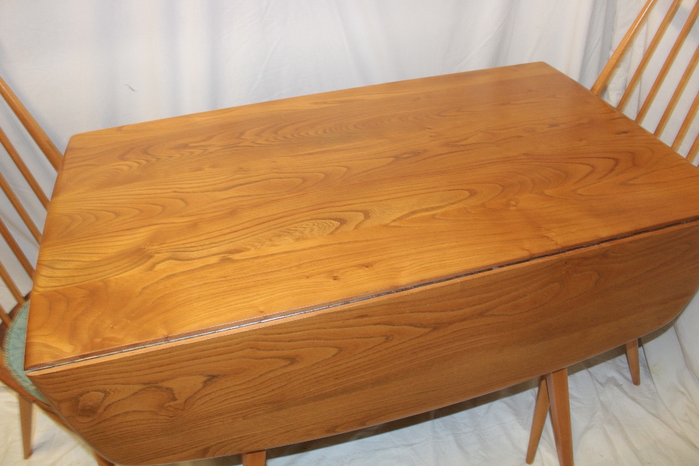 An Ercol pale elm drop-leaf dining table on square tapered legs together with a pair of - Image 2 of 2
