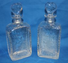 A pair of early 19th century cut-glass rectangular decanters with heart-shaped stoppers,