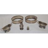 A pair of George III silver oval salt holders with pierced galleries and engraved decoration,