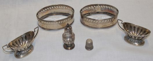 A pair of George III silver oval salt holders with pierced galleries and engraved decoration,