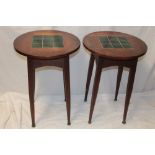 A pair of Edwardian oak circular occasional tables with green slate inset tops on turned legs