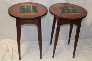 A pair of Edwardian oak circular occasional tables with green slate inset tops on turned legs