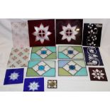 Four small stained leaded glass panels, 5½" x 7½"; a pair of ruby tinted glass star-cut panels,