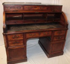 A 19th century mahogany cylinder top writing desk with internal drawers and sliding writing surface