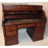 A 19th century mahogany cylinder top writing desk with internal drawers and sliding writing surface