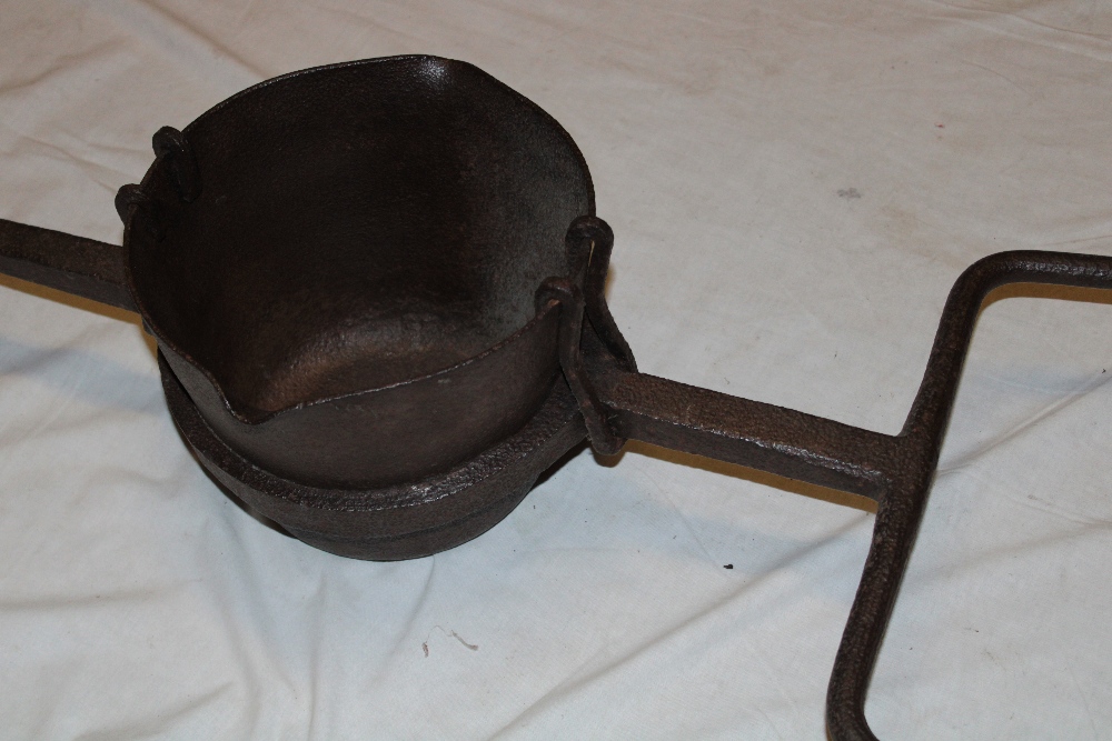 A large 19th century Cornish mining smelting iron pot with double pouring lips and iron frame, - Image 2 of 3