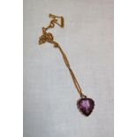 A 9ct gold heart-shaped pendant set amethyst with 9ct chain necklace (6.