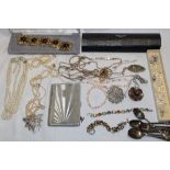 A selection of various costume jewellery including brooches bracelets, necklaces etc.