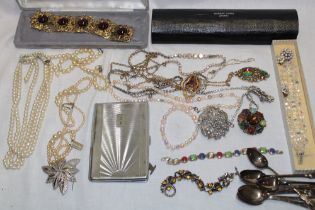 A selection of various costume jewellery including brooches bracelets, necklaces etc.