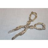 A Victorian silver scissor-action sugar tongs decorated all over with grape leaves and grapes,