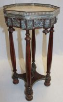 An unusual brass mounted mahogany octagonal occasional table with inset marble top and brass