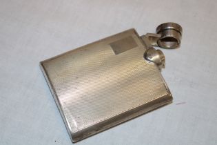 A small George VI silver concave spirit flask with engine turned decoration,