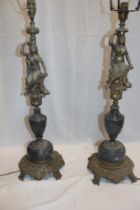 A pair of brass table lamps with female decorative stems on brass mounted grey marble tapered bases,