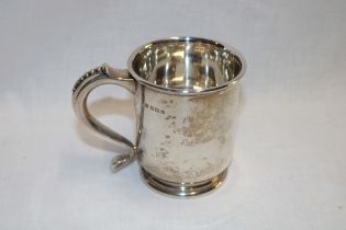 An Edward VII silver Christening-style tankard with scroll handle,