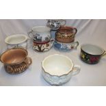 Nine various Staffordshire pottery chamber pots with floral decoration,