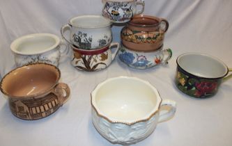 Nine various Staffordshire pottery chamber pots with floral decoration,