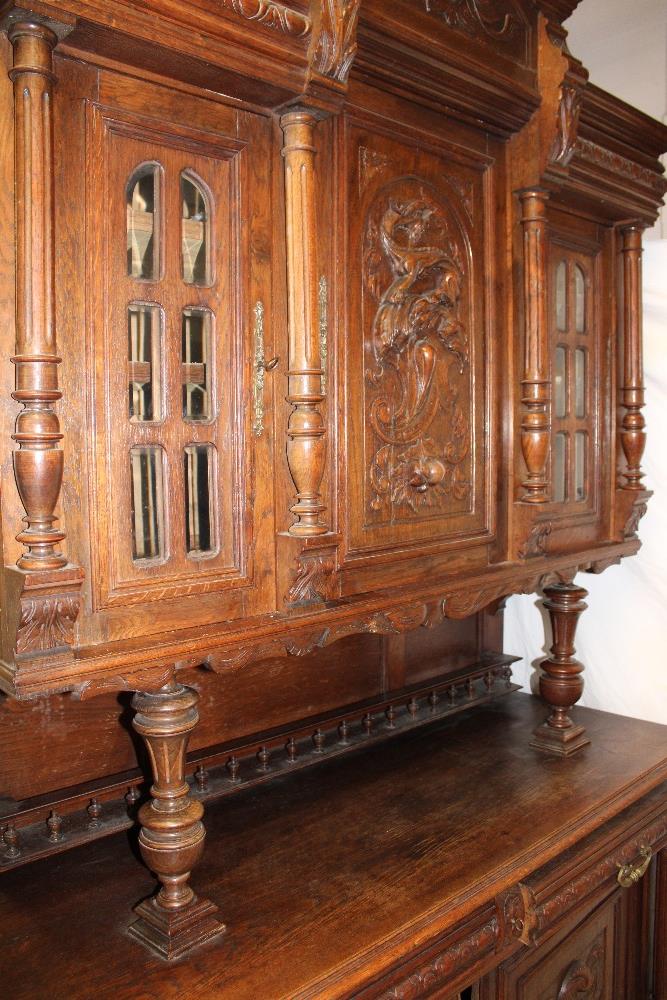 A 19th century Continental carved oak side cabinet with two drawers in the frieze and cupboard - Image 2 of 2