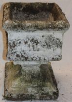 A weathered garden square-shaped pedestal urn with raised decoration on square base 22" high