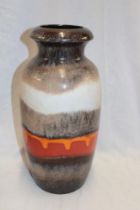 A West German pottery tapered vase with brown and orange decoration,