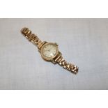 A ladies 18ct gold wristwatch by Certina with plated strap