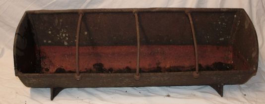 A 19th century Cornish farm cast-iron pig feeding trough with central bar dividers,