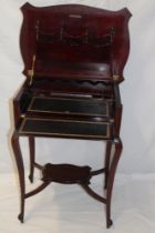 A late Victorian/Edwardian mahogany rectangular folding campaign-style desk with fitted interior