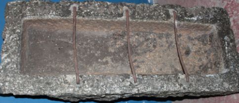 An 18th/19th century Cornish weathered granite rectangular pig feeding trough with original iron