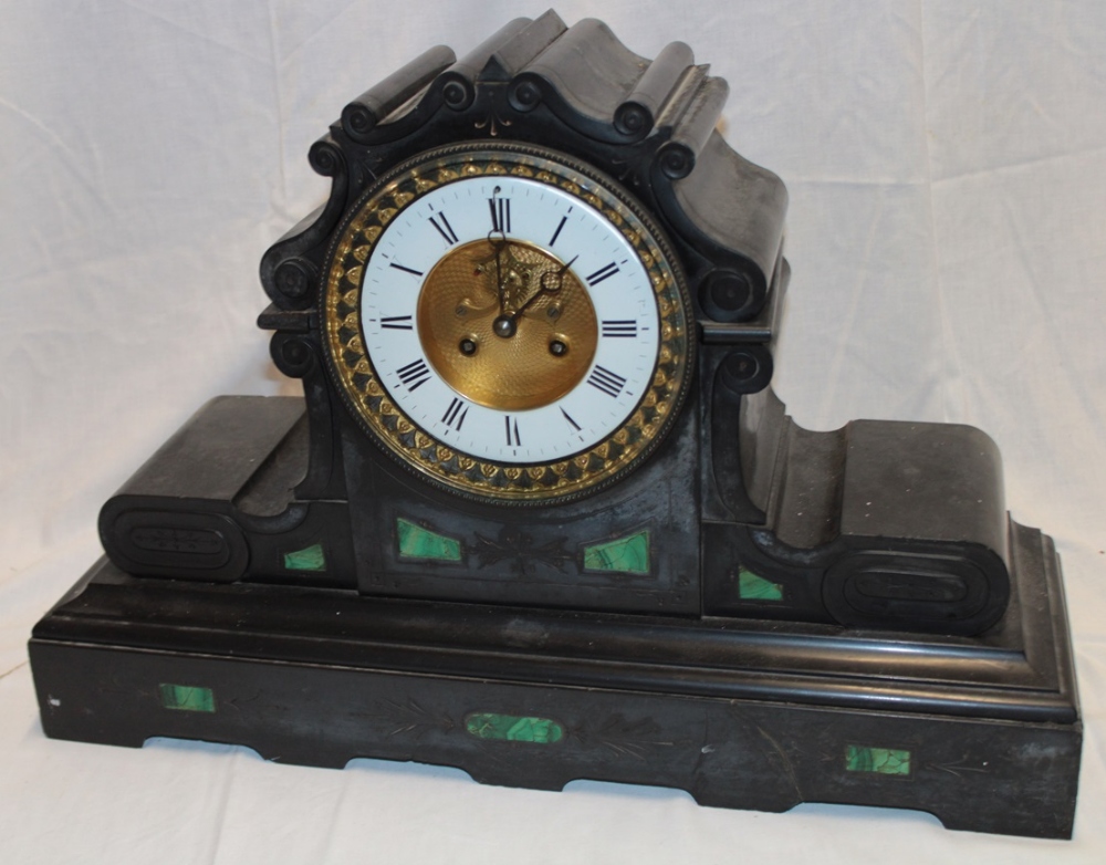 An impressive 19th century mantel clock with circular enamelled dial and part visible escapement in