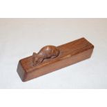 A piece of carved oak by Robert Thompson depicting a carved mouse 5" long