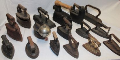 A collection of various vintage irons including box irons by Dalli and others, flat irons,